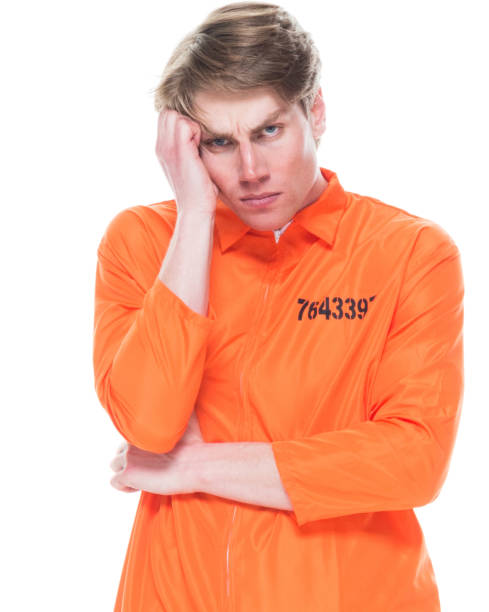 istock Male prisoner wearing orange jumpsuit 1145972476