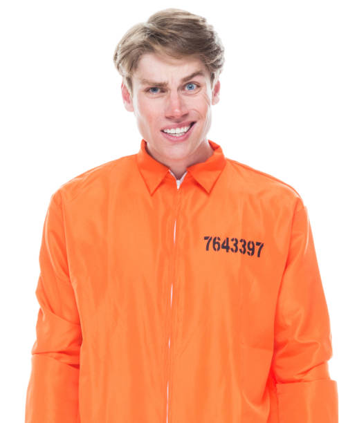 istock Male prisoner wearing orange jumpsuit 1145972477