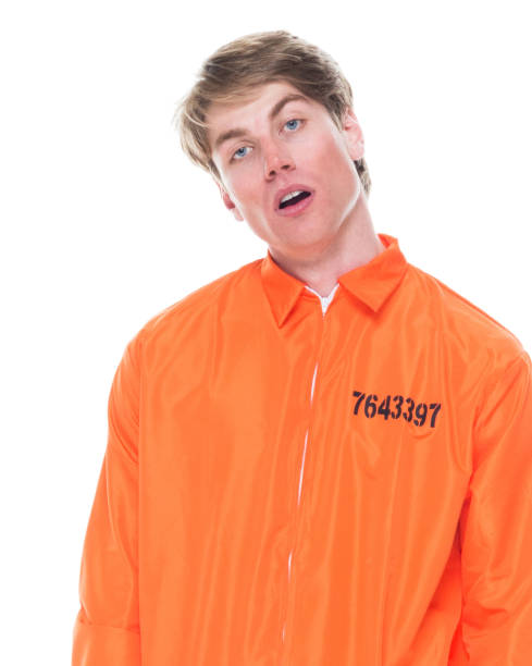 istock Male prisoner wearing orange jumpsuit 1145972573
