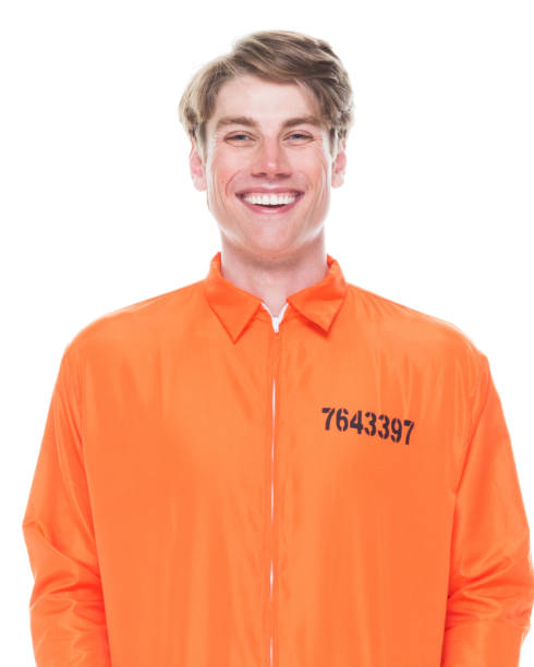 istock Male prisoner wearing orange jumpsuit 1145972574