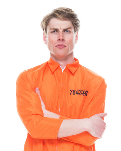 istock Male prisoner wearing orange jumpsuit 1145972653