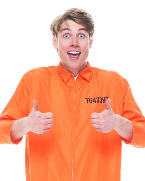 istock Male prisoner wearing orange jumpsuit 1145972656