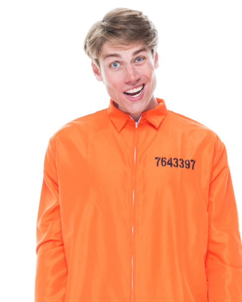 istock Male prisoner wearing orange jumpsuit 1145972667