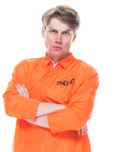 istock Male prisoner wearing orange jumpsuit 1145972710