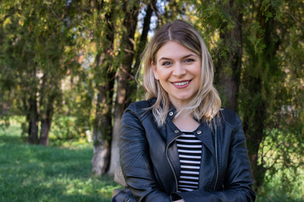 istock Woman sitting in the park 1145973741