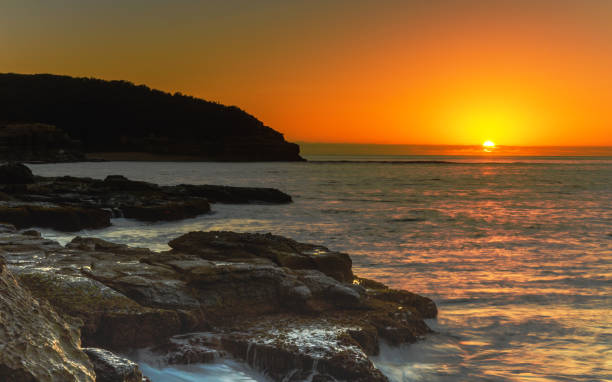 istock Sunrise Seascape with Orange Sky 1145973918