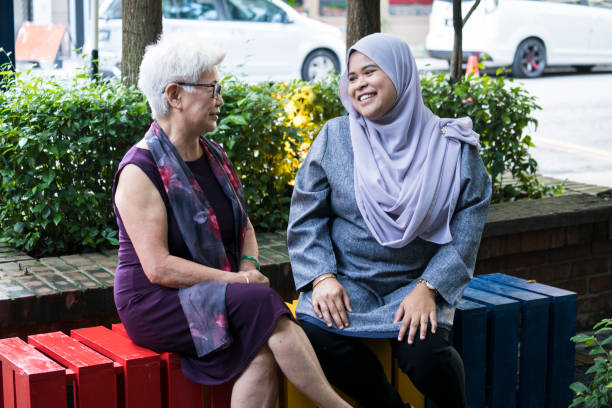 istock Friends chatting happily at the sidewalk 1145974410
