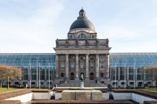view of famous State chancellery - Staatskanzlei in Munich, Germany view of famous State chancellery - Staatskanzlei with war memorial in the German city center of the Bavarian capital. bavarian state parliament stock pictures, royalty-free photos & images