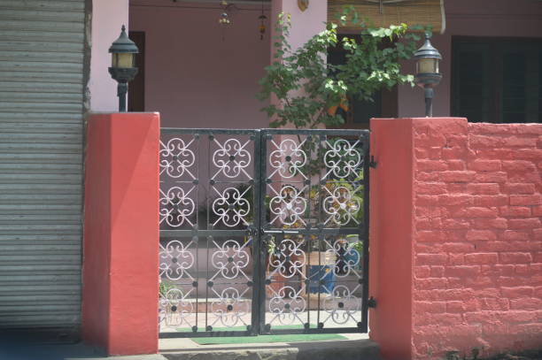 istock closed iron gate of house 1145977533