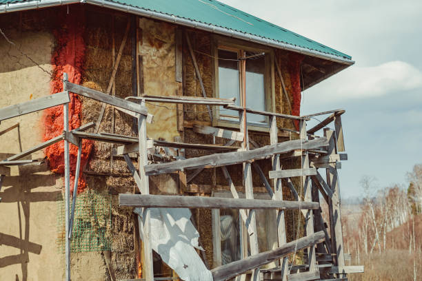 istock unfinished house of straw blocks 1145977544