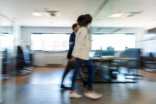 istock Business colleagues walking and talking 1145979125