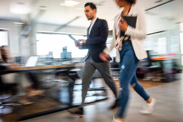 istock Business colleagues walking and talking 1145979135