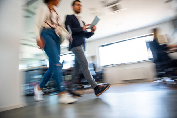 istock Business colleagues walking and talking 1145979137