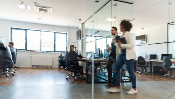 istock Business colleagues walking and talking 1145979139