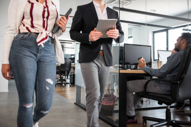 istock Business colleagues walking and talking 1145979156