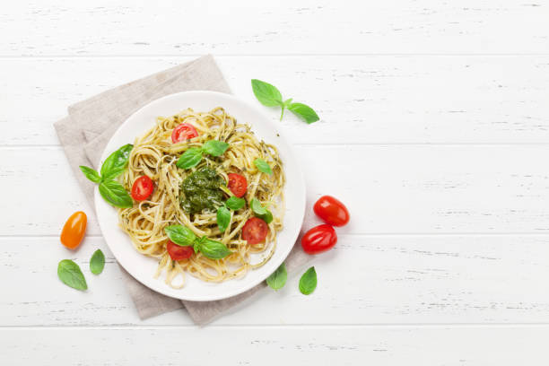 istock Spaghetti pasta with pesto sauce 1145982976