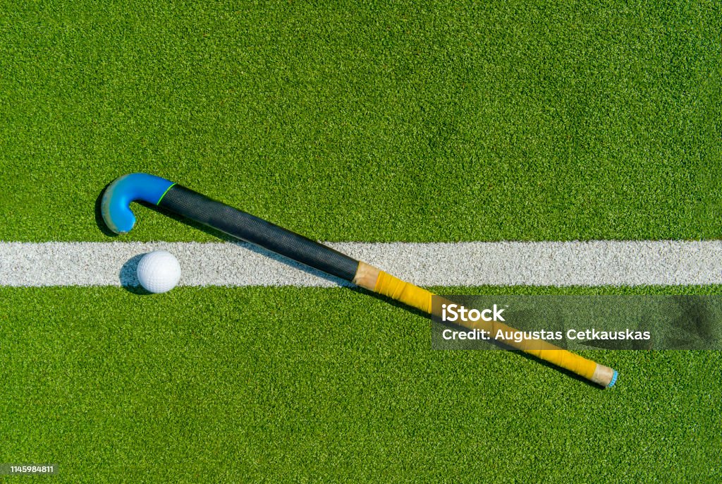 Field Hockey Stick And Ball On Green Grass Stock Photo - Download Image Now  - Field Hockey, Hockey Stick, Hockey - iStock