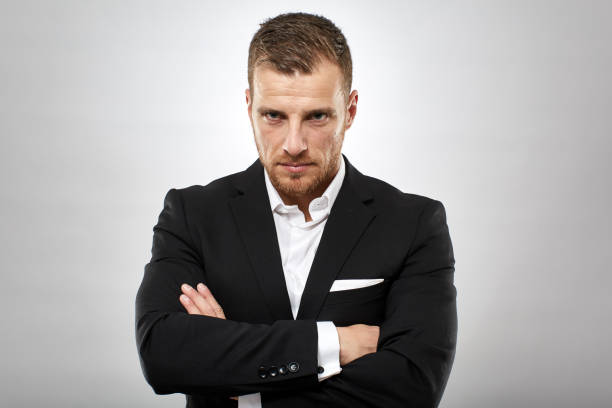 istock Unhappy businessman frowning 1145985999