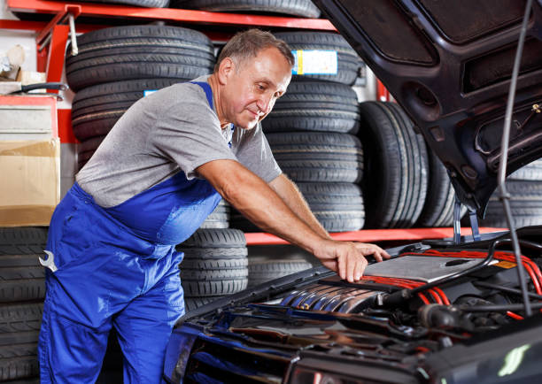 istock Technician working at service station, repairing car 1145988712