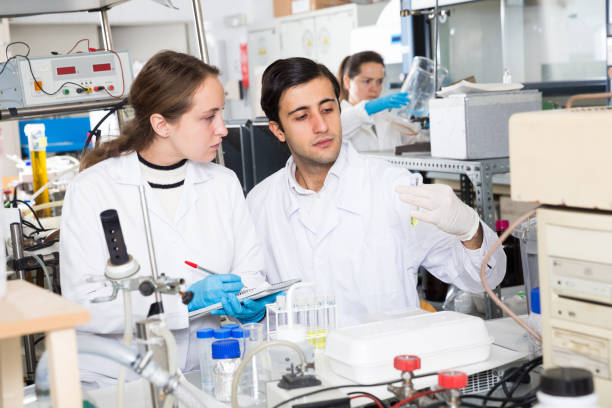 istock Scientists noting results of research in test chart 1145988952