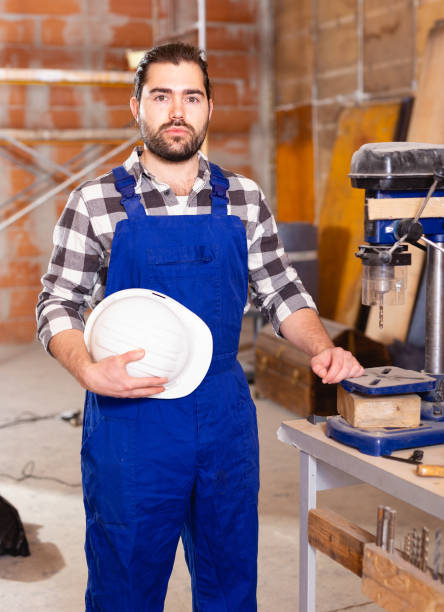 istock Portrait of worker who works on drilling machine 1145990173