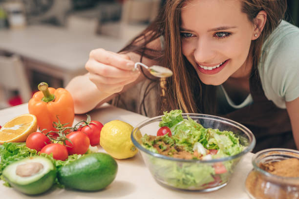 istock Smiling girl in the kitchen 1145992028