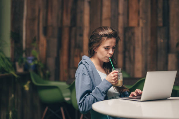 istock Working young woman with laptop 1145992222