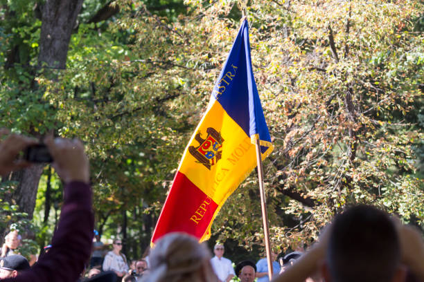 Moldavian flag carried through the main street of Chisinau, Moldova during Independence Day celebrations Chisinau, Rep. of Moldova - August 27, 2016: Moldavian flag carried through the main street of Chisinau, Moldova during Independence Day celebrations chisinau photos stock pictures, royalty-free photos & images