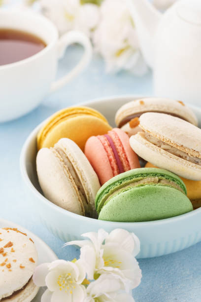 istock Colorful french macarons with different fillings in a bowl. 1145995208