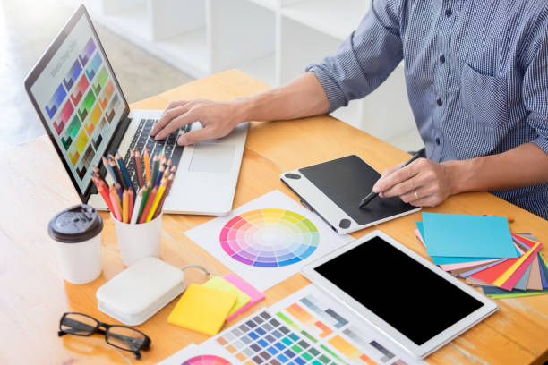 istock Midsection Of Entrepreneur Analyzing Color Swatch In Office 1145998726