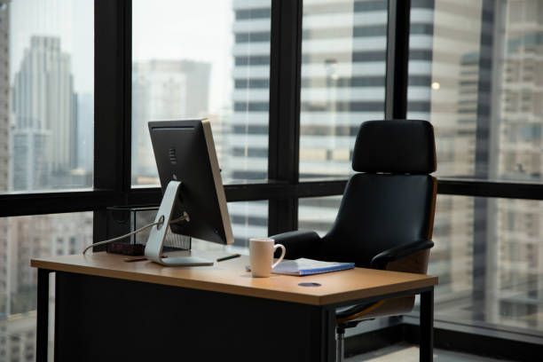 istock Chair And Table Against Window In Office 1146001597