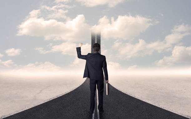 istock Businessman looking at 3d road that goes up in the sky 1146005282