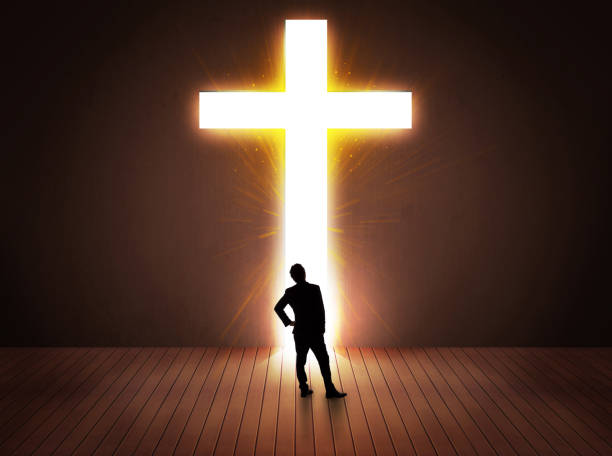 istock Man looking at bright cross sign 1146005561