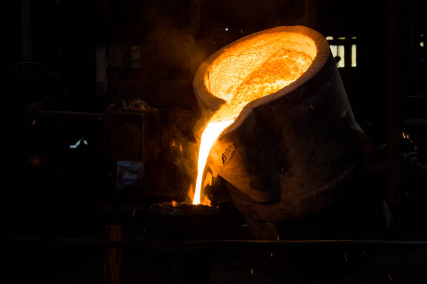 istock metal casting process with red high temperature fire in metal part factory 1146006900
