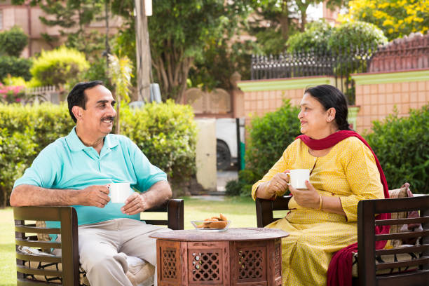 istock Couple having breakfast outdoors - stock images 1146006933
