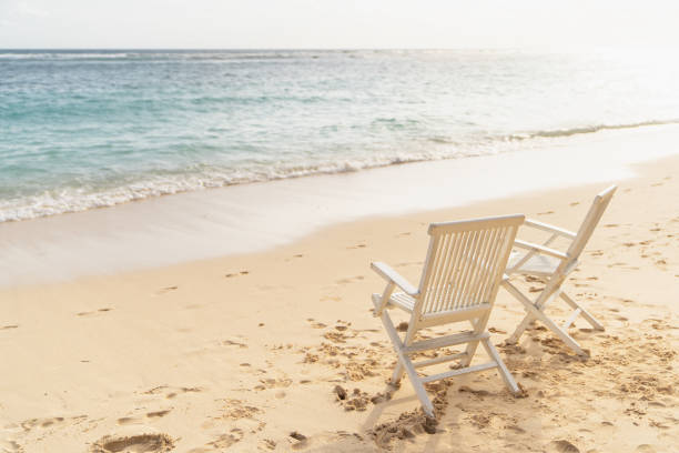 istock Bali, Bukit. Two white chairs on the beach 1146011678