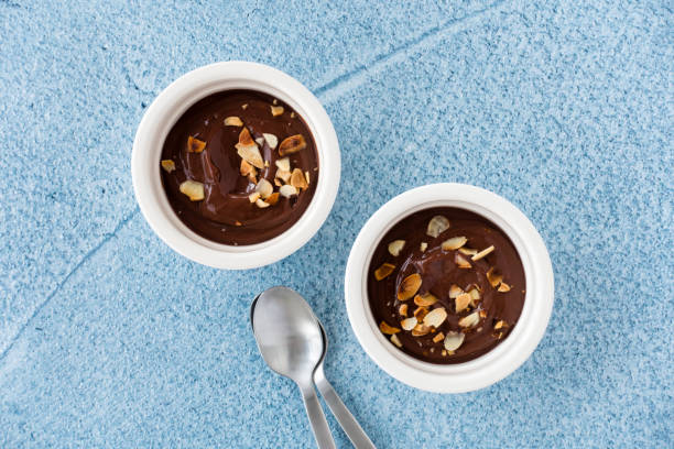 istock Top View of Chocolate Dessert in Ramekins on Blue Background 1146015467