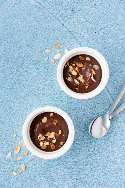 istock Dark Chocolate Dessert in Ramekins on Blue Concrete 1146015472