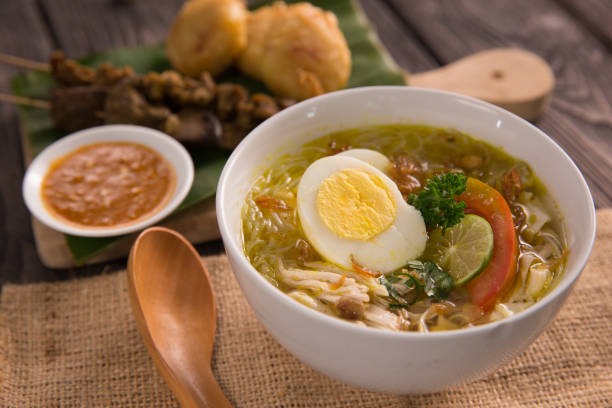 soto chicken. shreedded chicken soup soto ayam. shreedded chicken soup with egg. indonesian food central java province photos stock pictures, royalty-free photos & images
