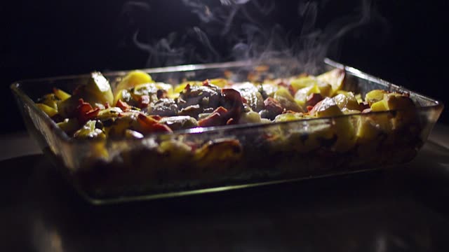 roast meat with vegetables cooked at home in the oven