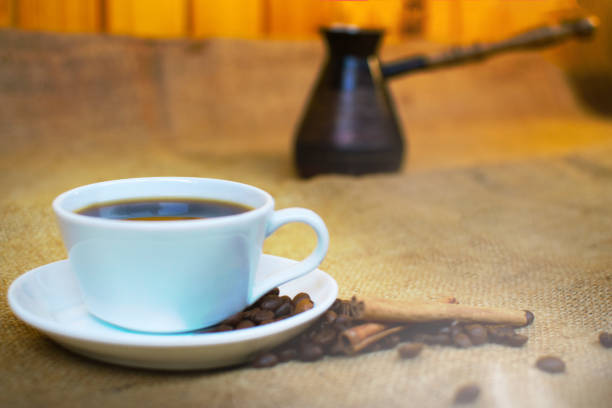 istock White cup of coffee and turkish pot. 1146017815