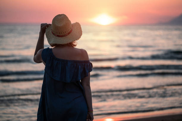 istock Walking near sea at sunset 1146021173