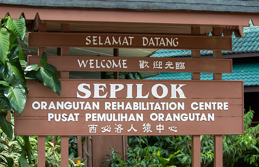 The sign at the main entrance to the Sepilok Orangutan Rehabilitation Centre in Borneo.