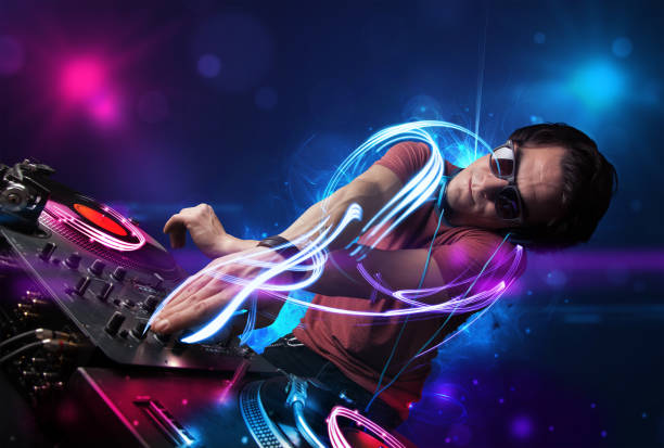 istock Disc jockey playing music with electro light effects and lights 1146025613