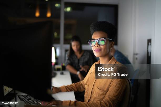 Portrait Of Businesswoman Working Late In The Office Stock Photo - Download Image Now