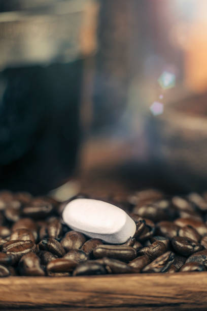 istock Caffeine Supplement Pill and Coffee Beans 1146027055