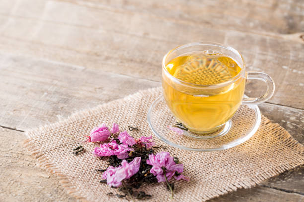 istock Cup of tea and pink spring cherry blossom 1146027210