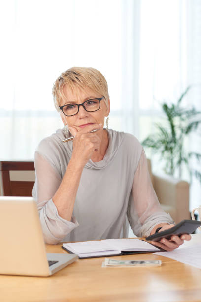 istock Woman calculating her bills 1146027357
