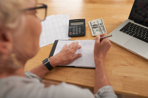 istock Woman calculating her budget 1146027362