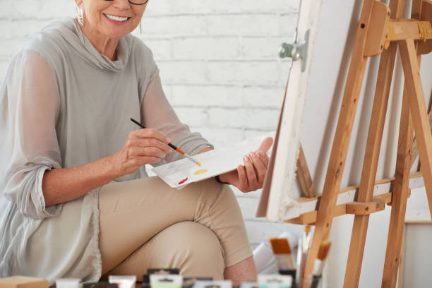 istock Woman painting picture in studio 1146027388